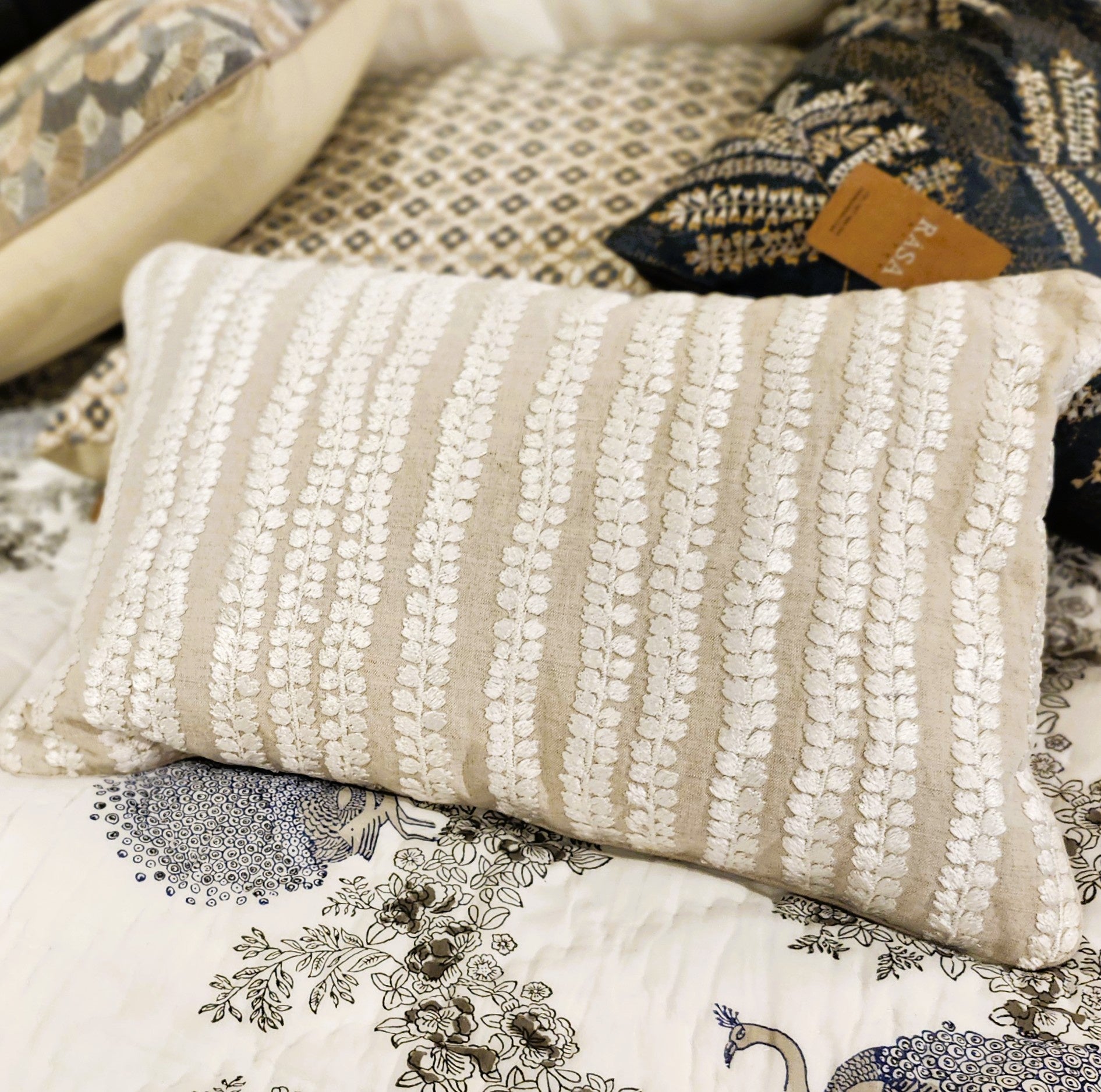 Natural Beige embroidered cushion by Rasa Jaipur, 30 x 46 cm, styled view