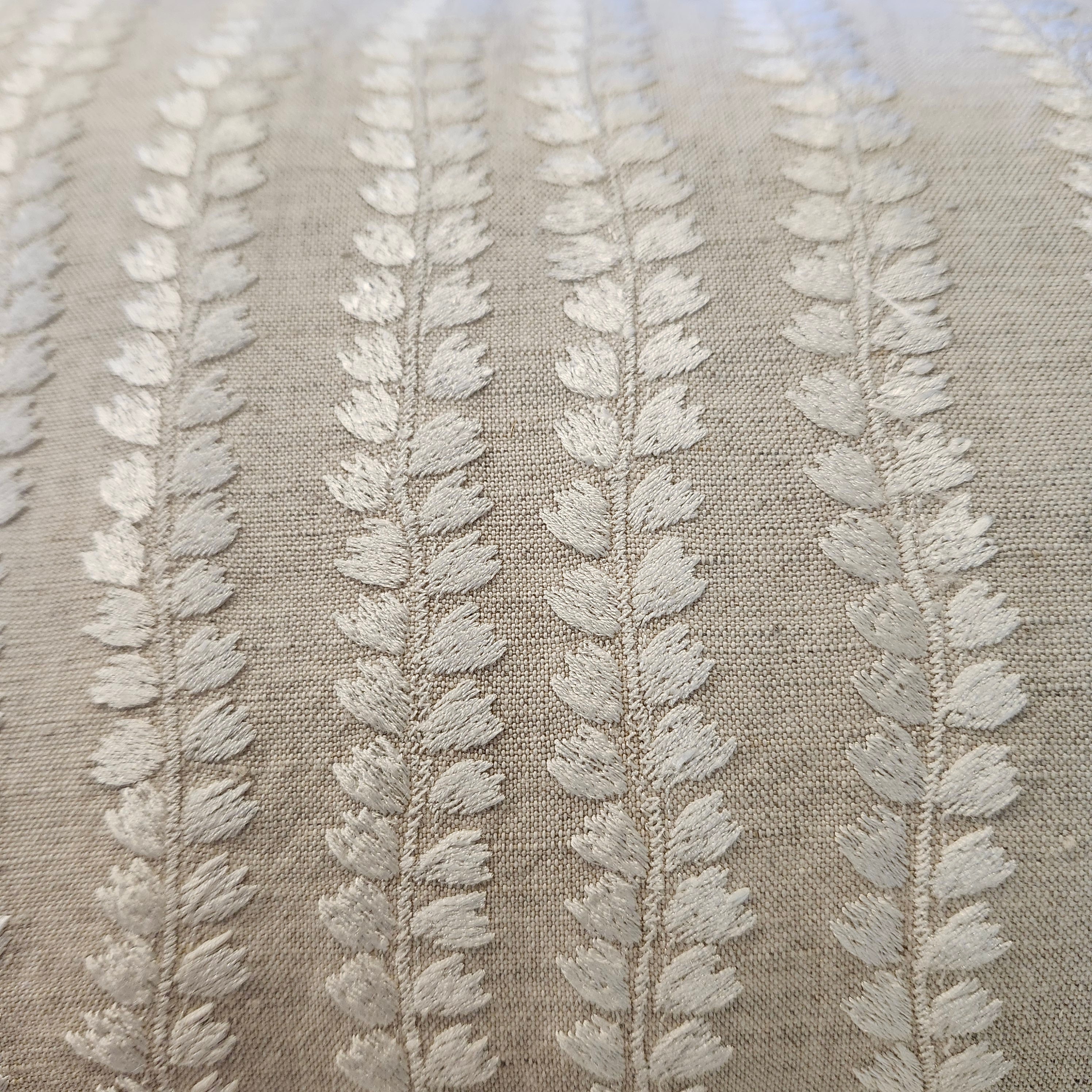 Natural Beige embroidered cushion detail showing white floral embroidery on cotton linen, 30 x 46 cm
