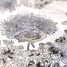 Close-up of blue peacock block print on white voile