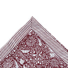 Burgundy rainforest block-print cotton tablecloth with striped edges