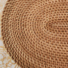 Oval rattan placemat, handwoven, protects table from hot dishes, detail