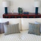 Lacquer table lamp styled on a red cabinet, white drum shade