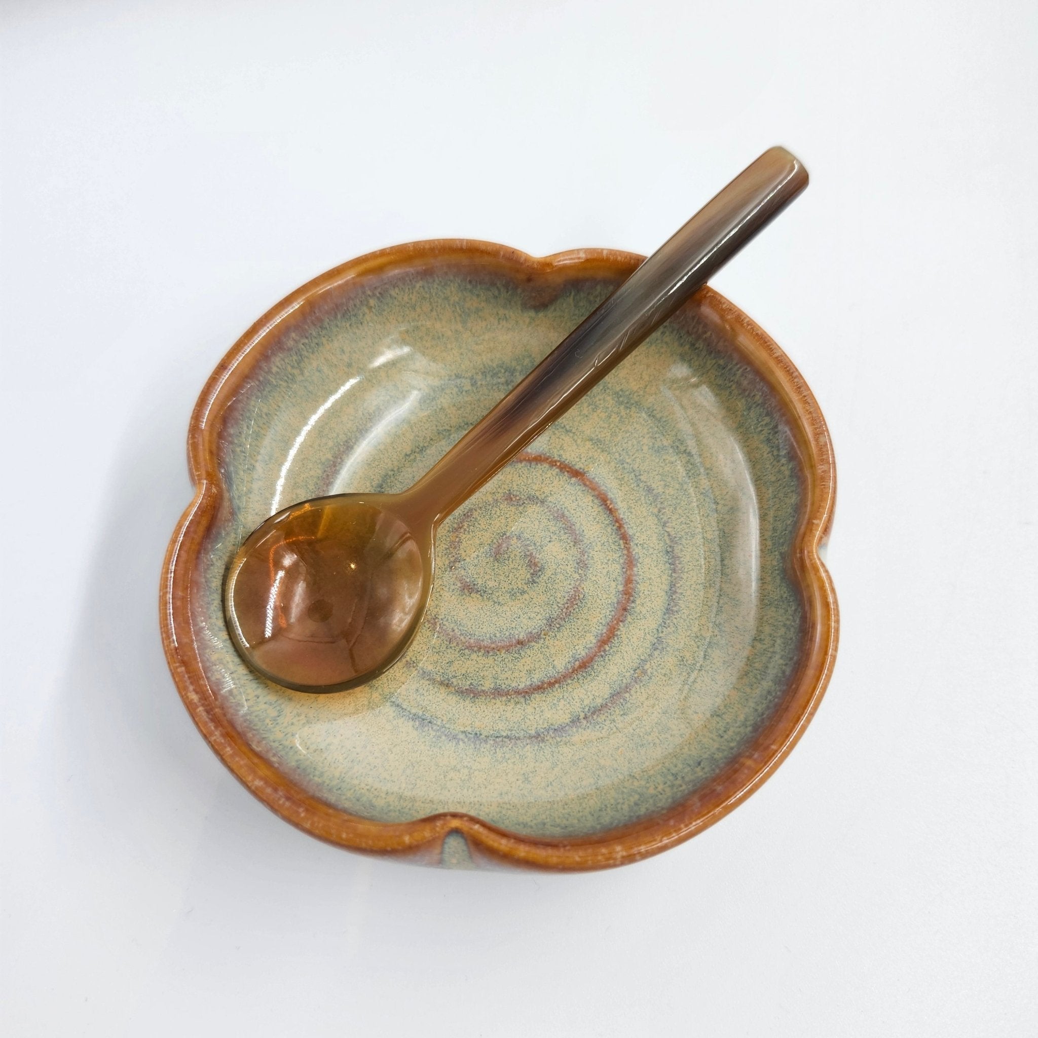 Jade quatrefoil ceramic dish with polished glaze, styled detail