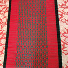 Handwoven festive table runner in red cotton, handloom woven
