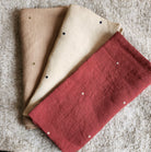 Set of six 100 per cent linen napkins embroidered with contrast polka dots, each 50 by 50cm square.