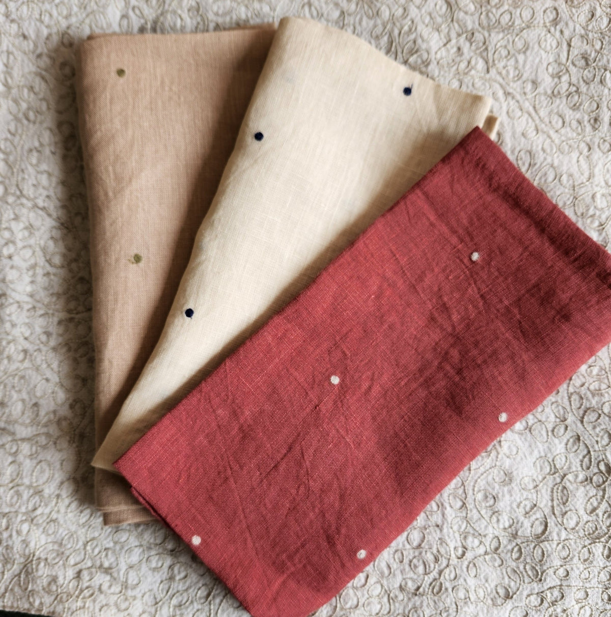 Set of six 100 per cent linen napkins embroidered with contrast polka dots, each 50 by 50cm square.