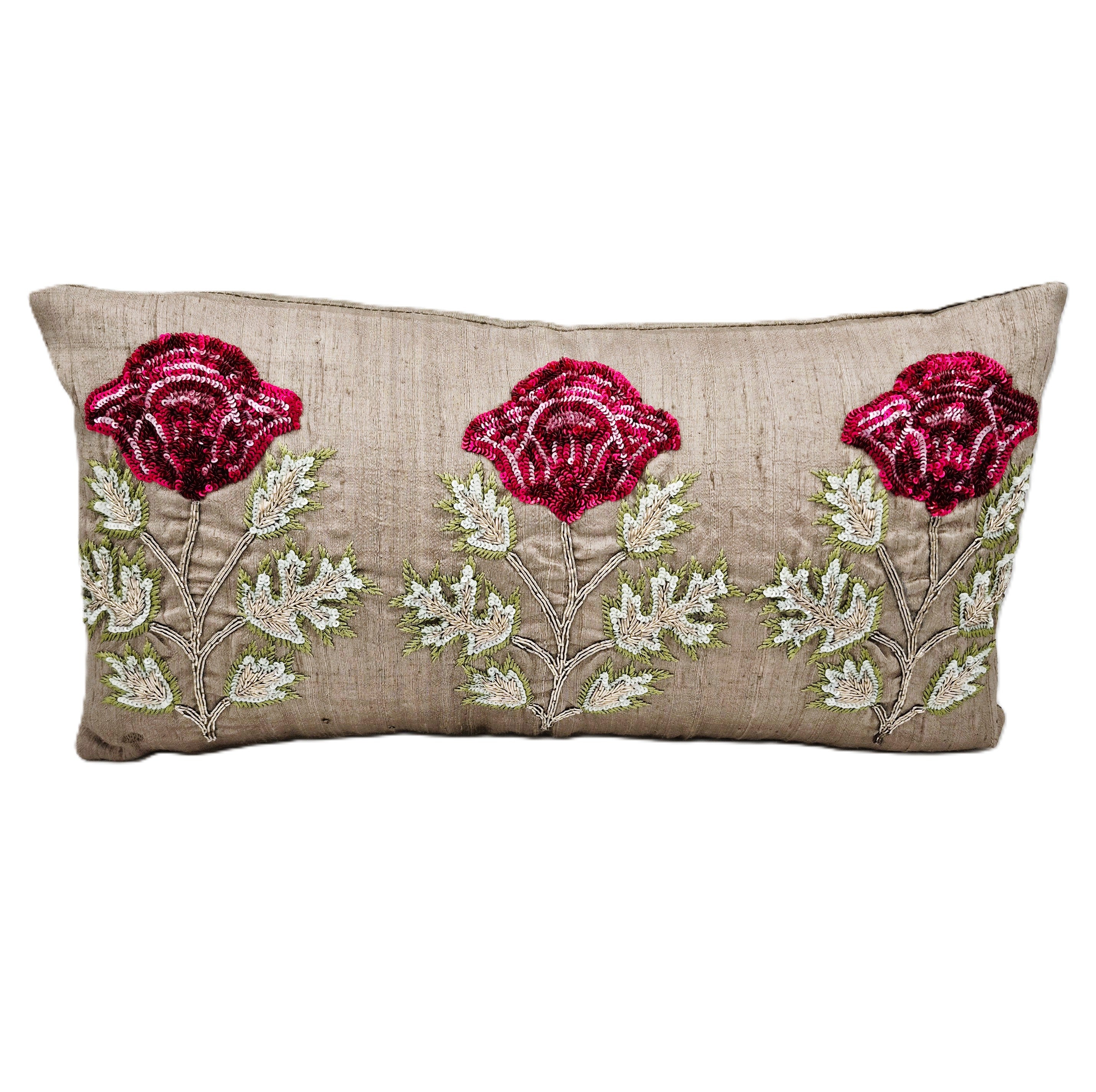 Decorative pillow with embroidered red poppies on a neutral raw silk background