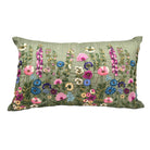 Decorative pillow with embroidered floral pattern on a green raw silk background