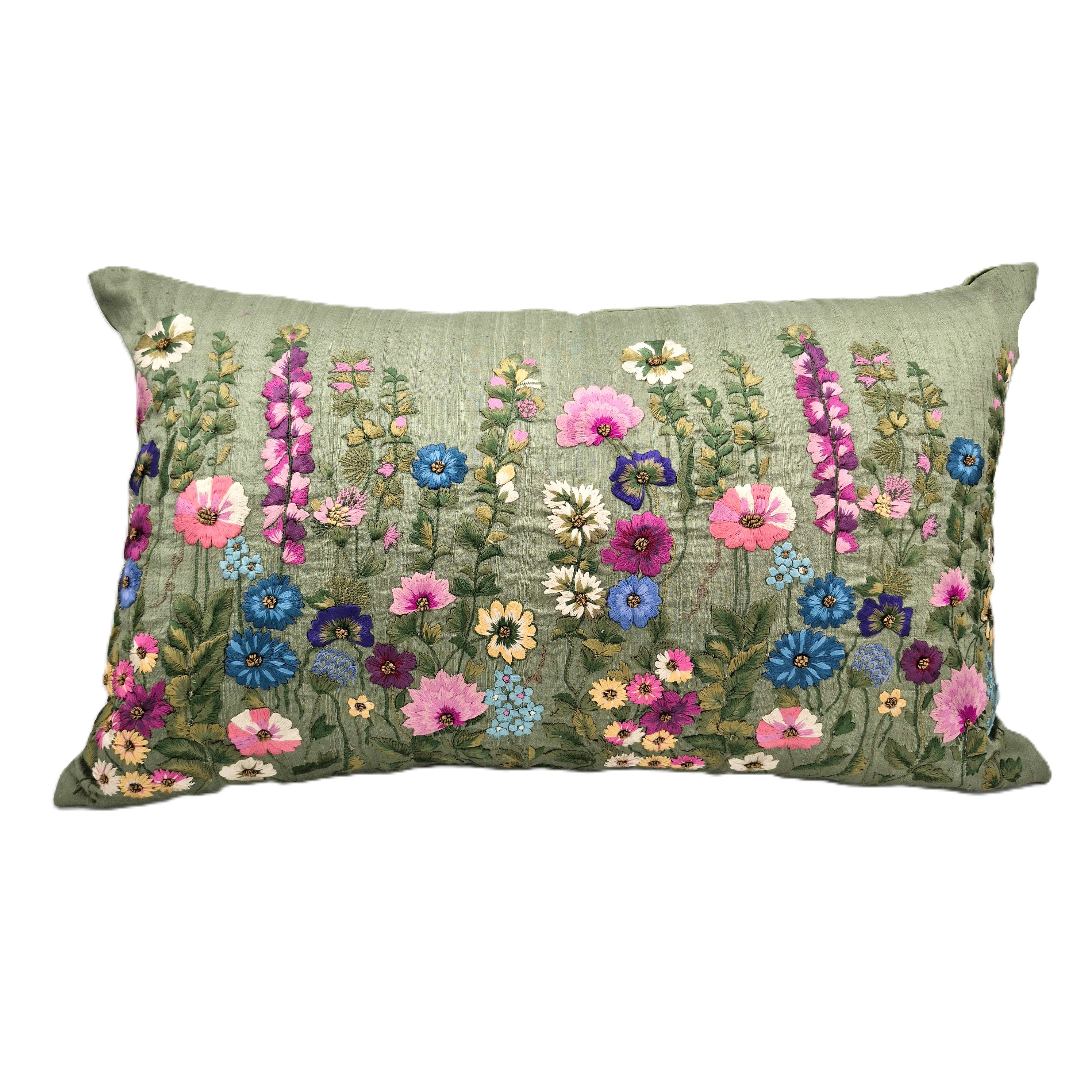 Decorative pillow with embroidered floral pattern on a green raw silk background