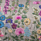 Close up of embroidery on raw silk flowers cushion