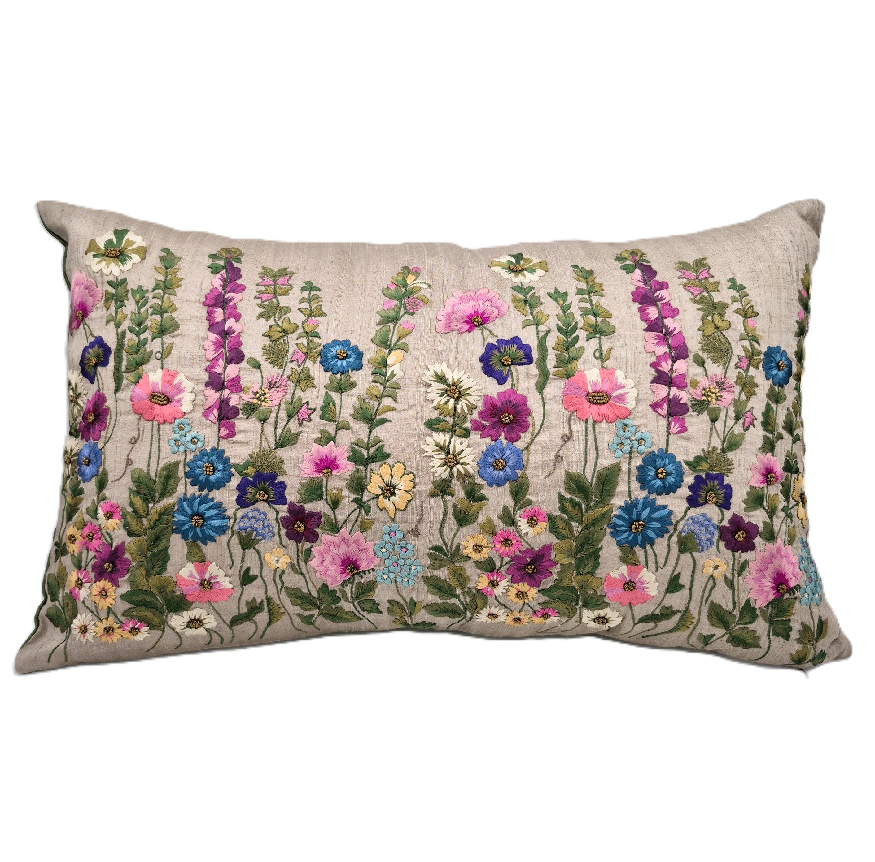 Decorative pillow with embroidered floral pattern on a beige background