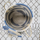 Blue seagrass laundry basket, lid top view, handwoven