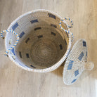 Medium blue seagrass laundry basket with lid, side view