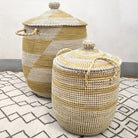 White-detail seagrass laundry baskets with lids and handles, three sizes, handwoven