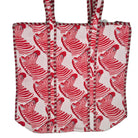 Zebra block-print quilted cotton shopper bag with red zebras on white, contrast lining and zip closure