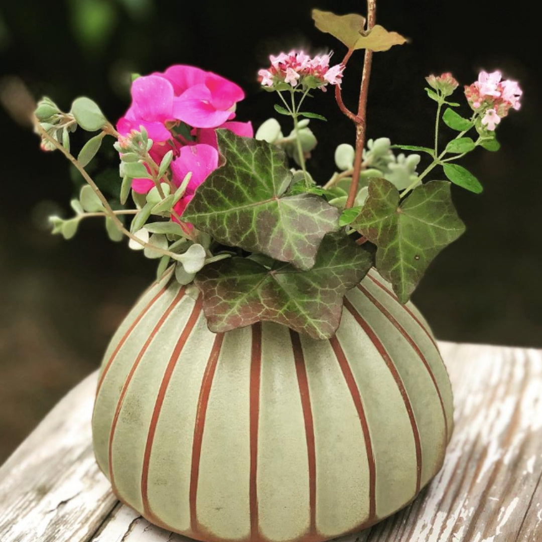 Salon round vase in avocado, ribbed terracotta, styled view