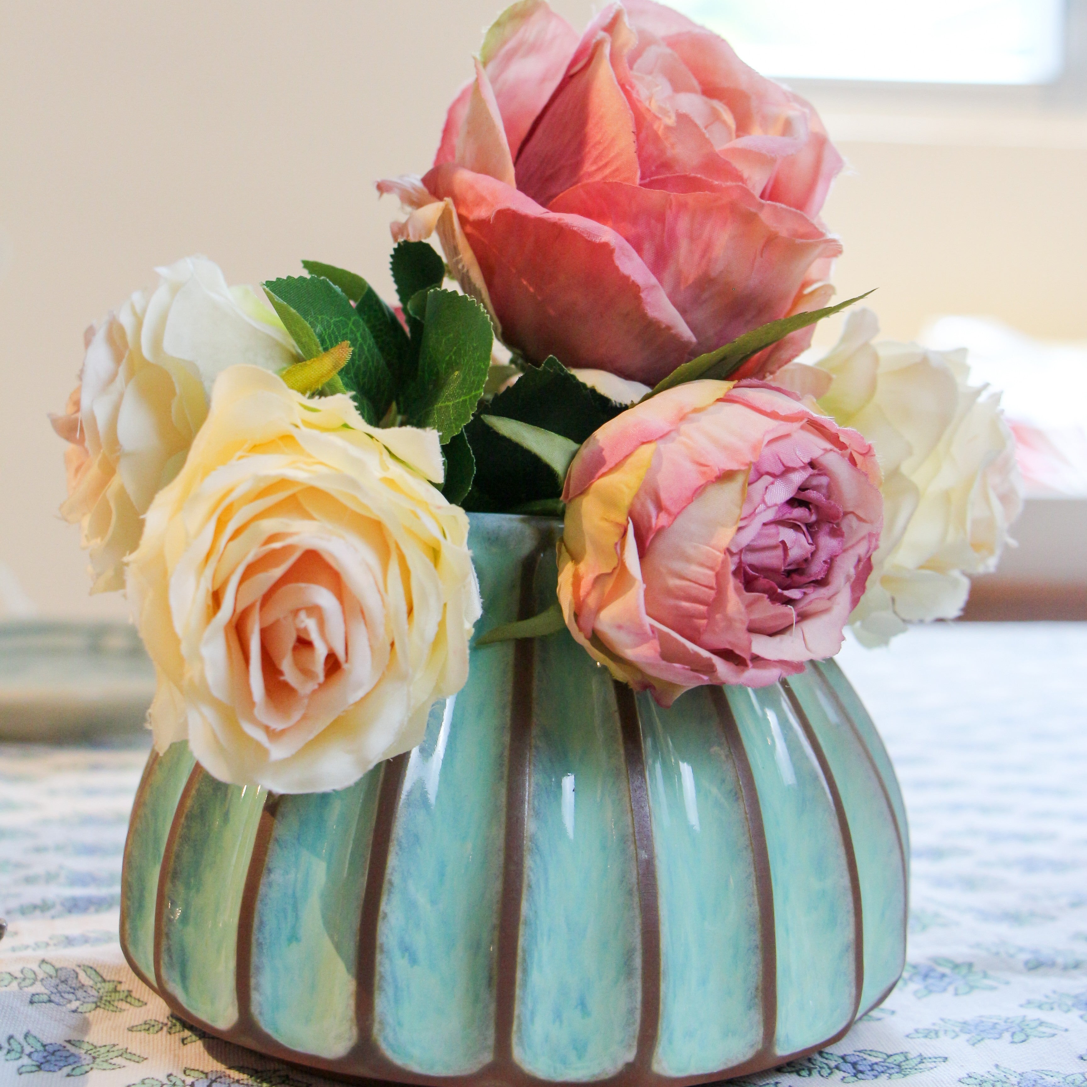 Melange turquoise Salon round vase, ribbed terracotta, styled view