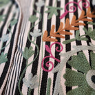 Black and white striped suzani jacket, green embroidery, detail