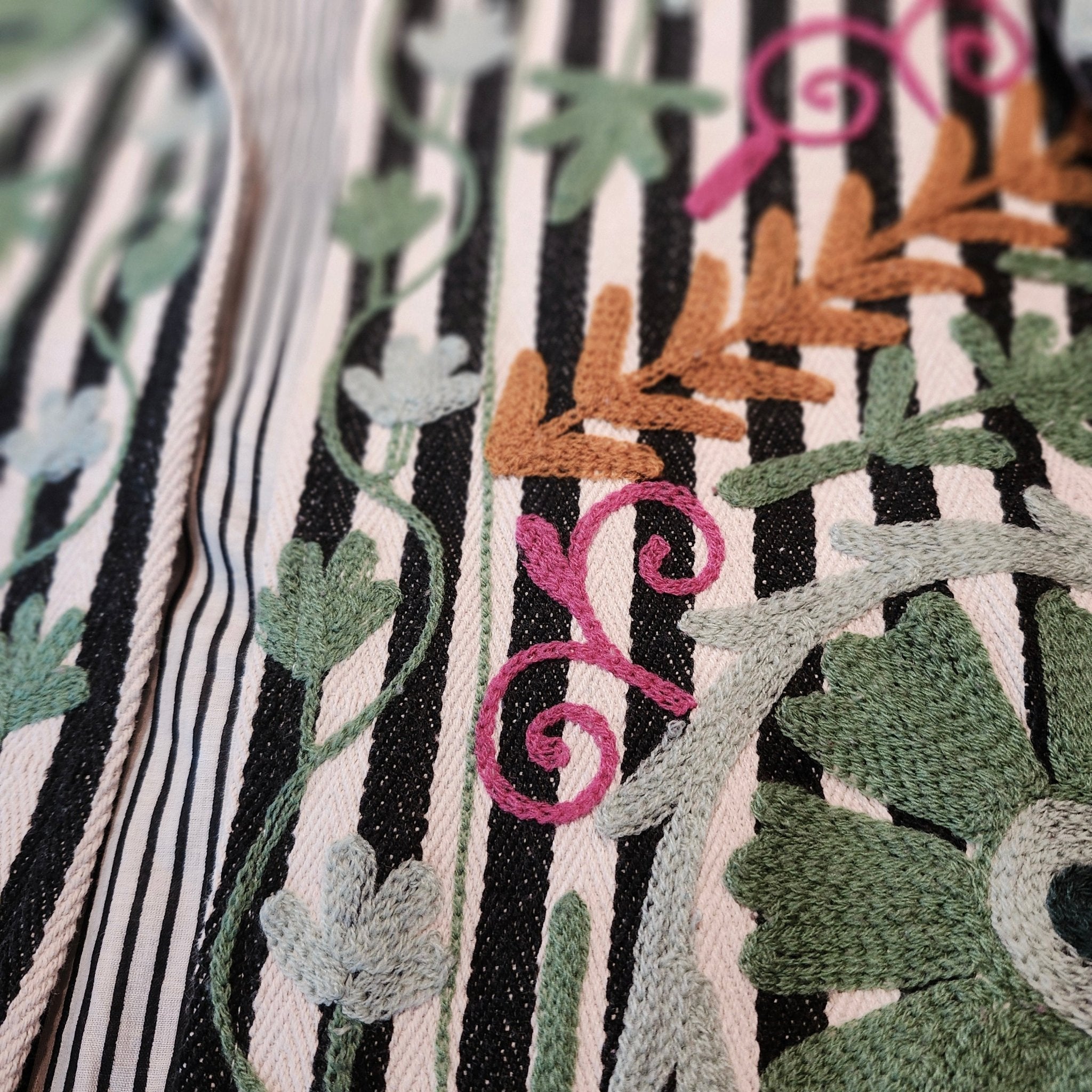 Black and white striped suzani jacket, green embroidery, detail