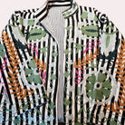 Striped suzani jacket, black and white with green suzani stitching, back view