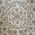 Hand Embroidered suzani in beige on a cream background