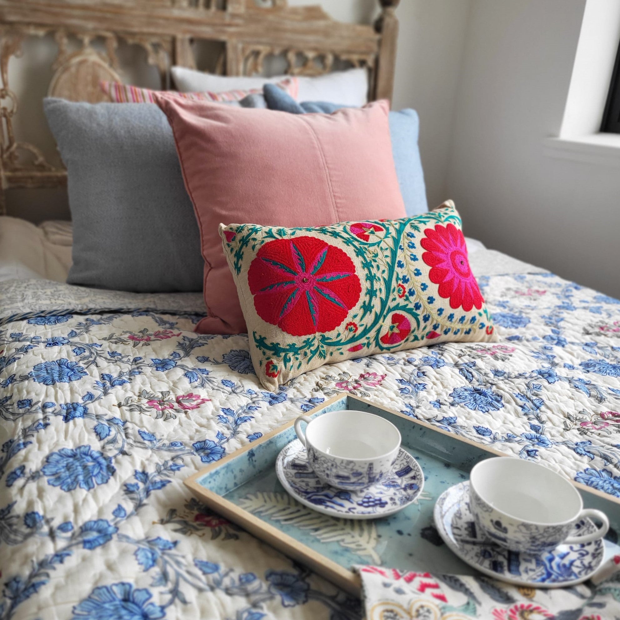 Suzani Fergana linen cushion, turquoise, pink and red, detail
