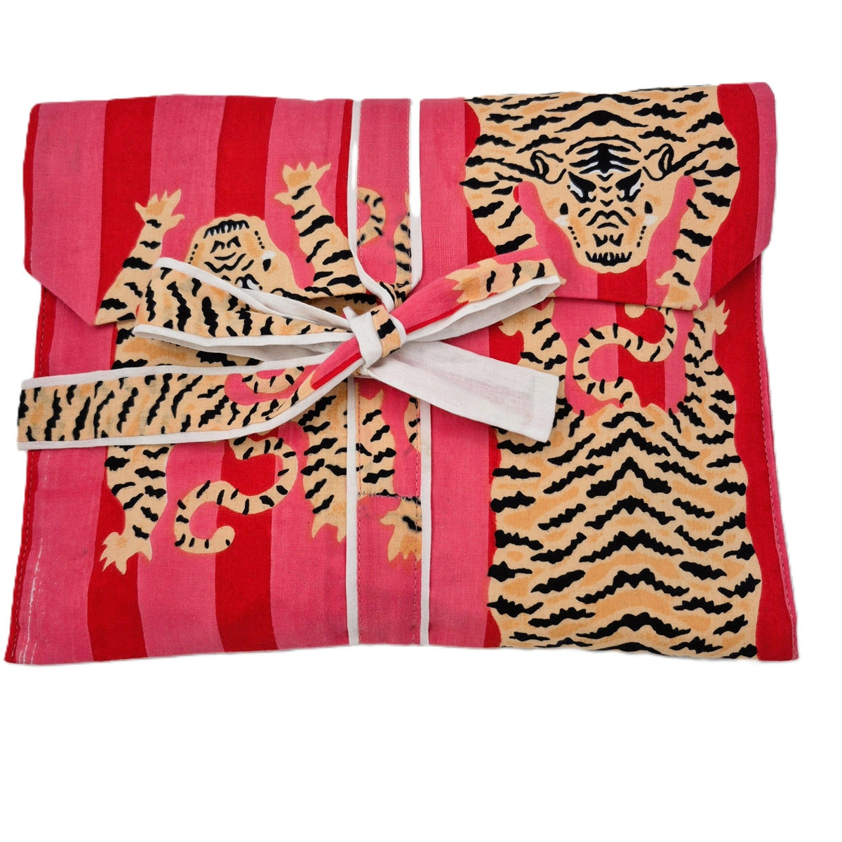 Block printed tiger design against a striped background on a cotton poplin pyjama top and bottoms.