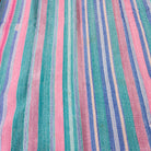 Faded pastel striped kantha quilt, folded