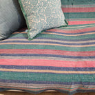 Vintage kantha quilt in pastel stripes, draped