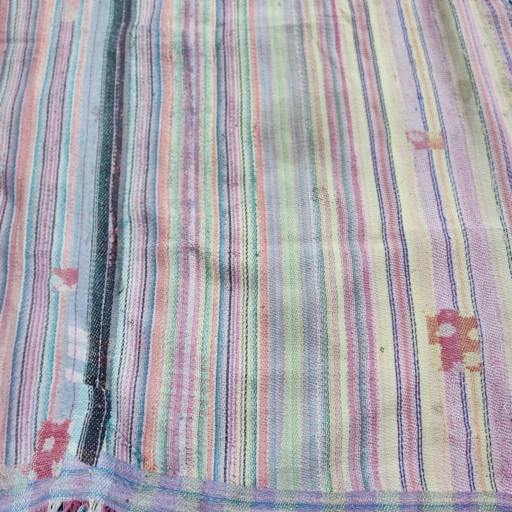 Green, pink and yellow vintage kantha quilt, stitch detail