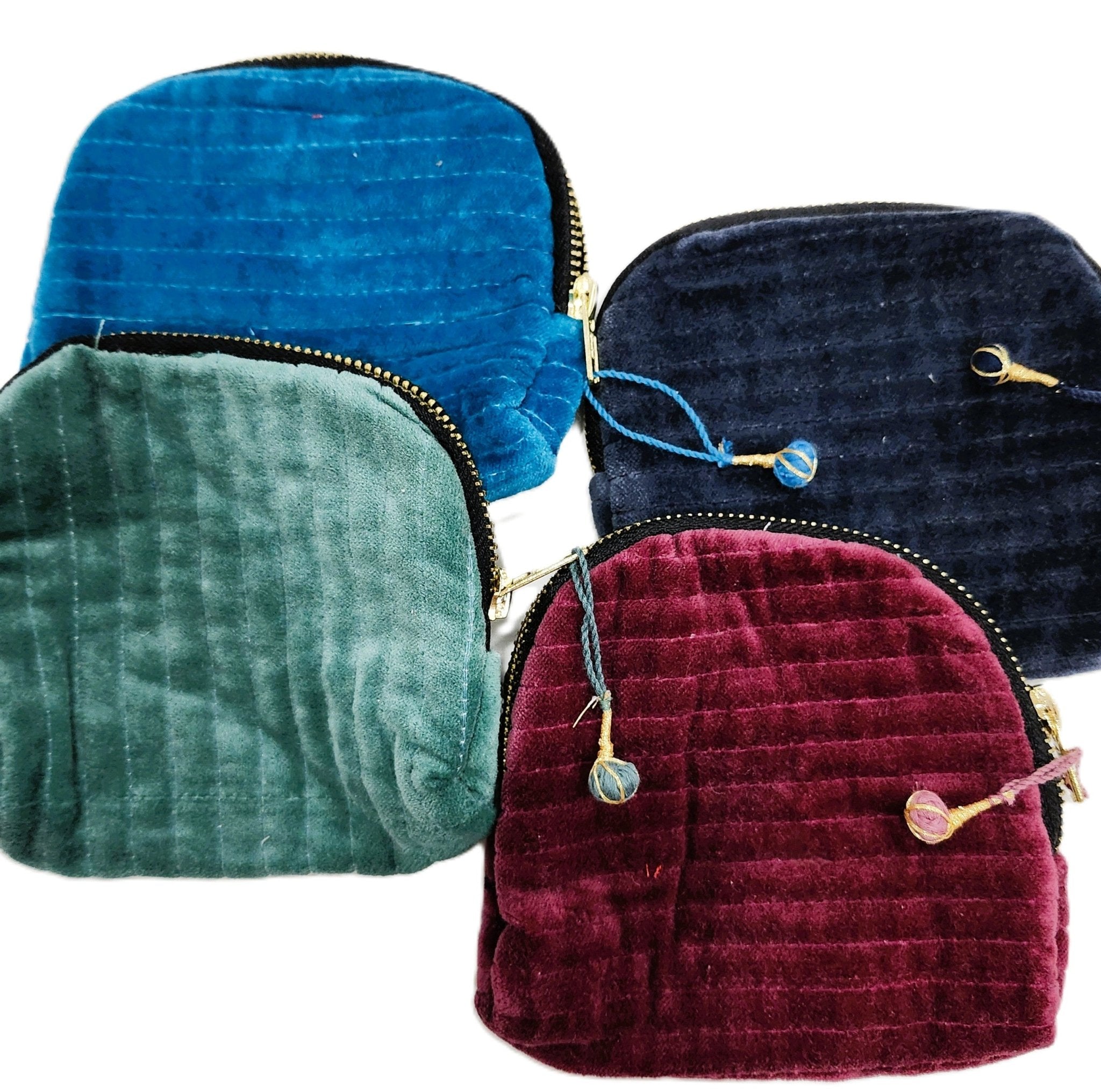Small velvet pouch with a block print lining, two internal pockets and a brass zip, 5 inches square.
