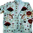 Aquamarine velvet jacket with hand worked suzani stitching, lined in pale blue striped cotton block print.