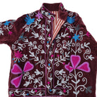 Burgundy velvet jacket with hand worked suzani stitching, lined in a complementary red stripe block print.