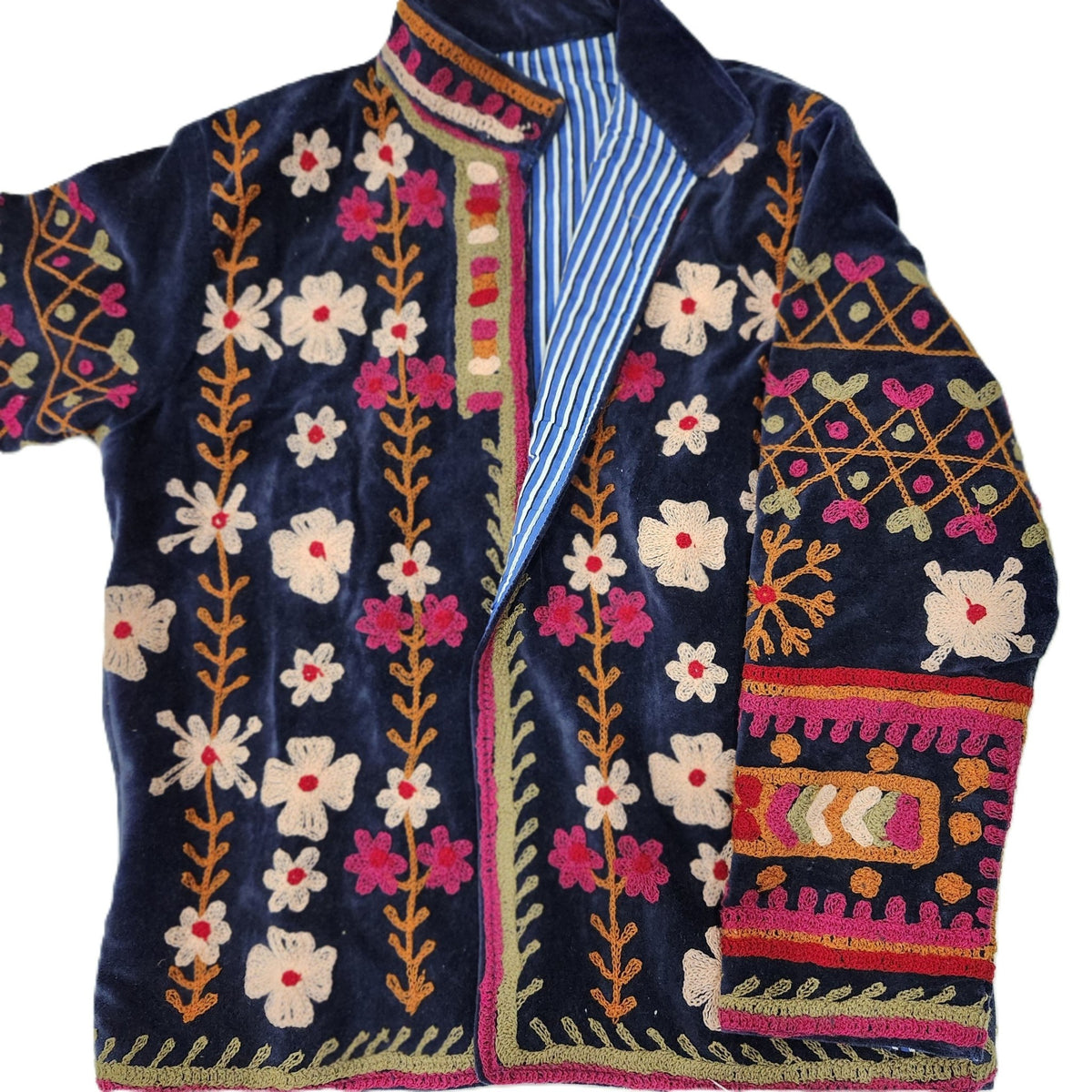 Navy velvet jacket with hand worked suzani stitching, lined in blue striped cotton block print, two pockets.