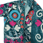 Teal velvet jacket with hand worked suzani stitching, lined in a teal and grey striped cotton block print.