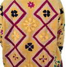 Yellow velvet jacket with hand-worked suzani stitching, contrast lining