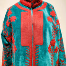Turquoise suzani velvet coat, hand-worked cerise stitching, styled