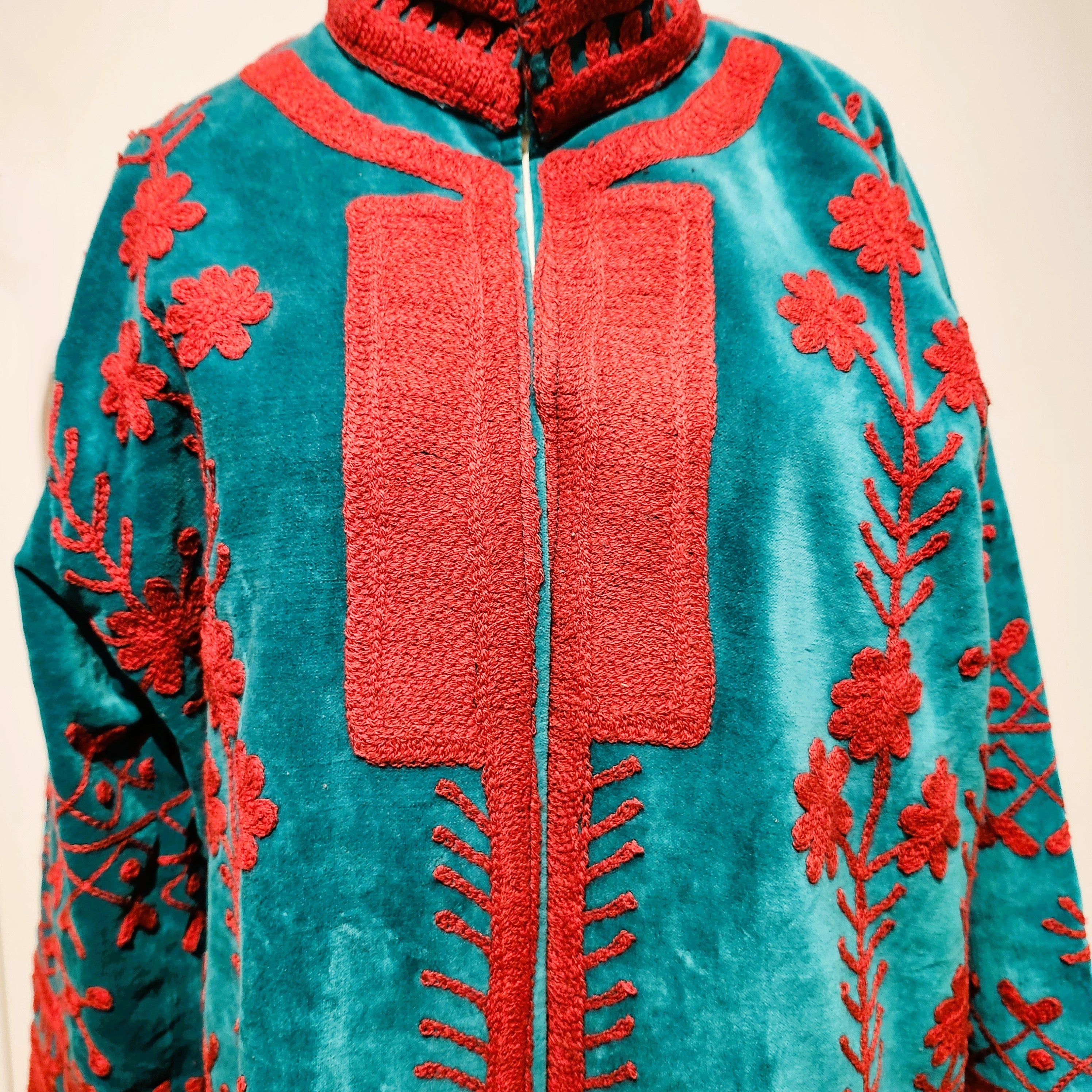 Turquoise suzani velvet coat, hand-worked cerise stitching, styled