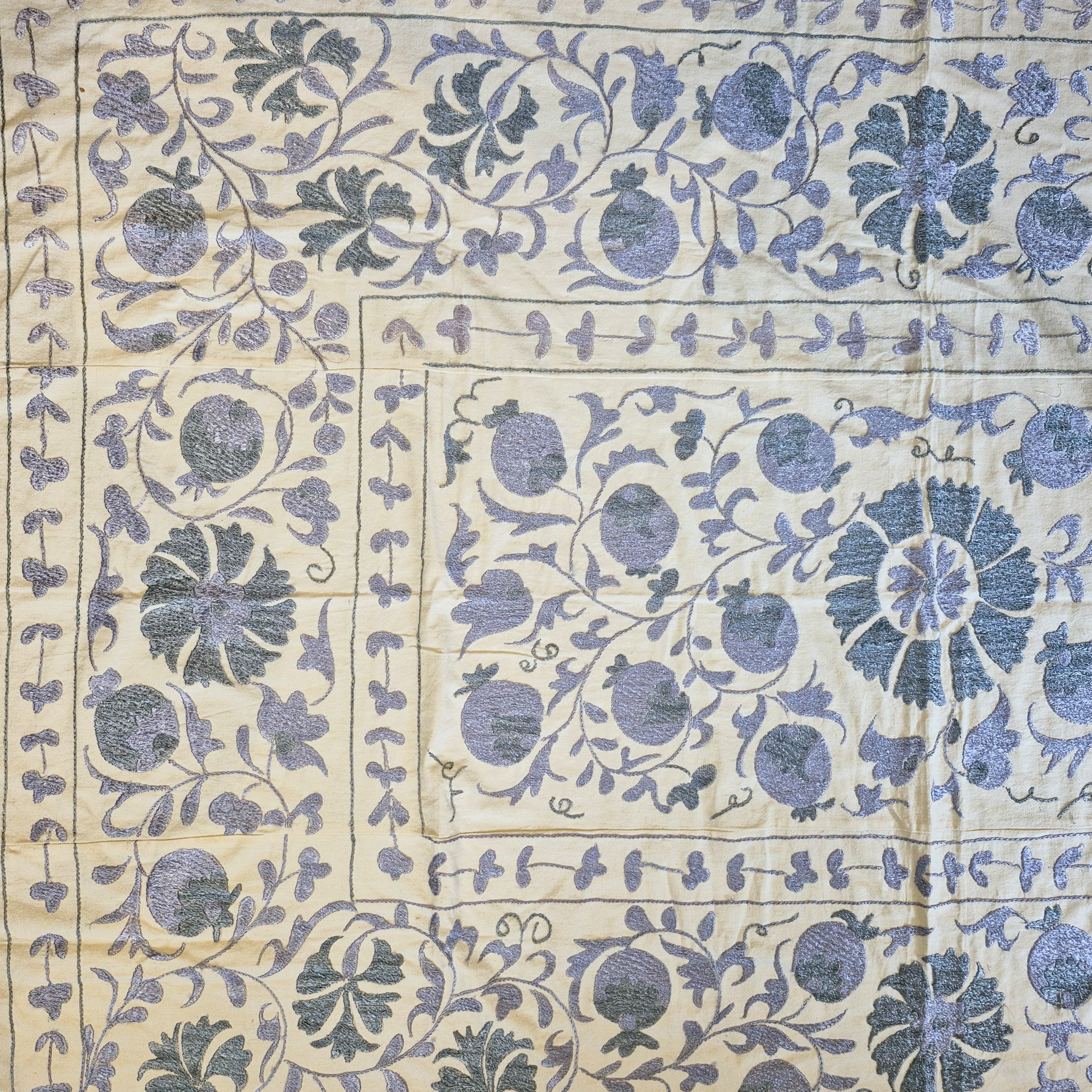 Vintage suzani fabric in petrol and grey, hand stitched silk embroidery on a cotton base, detail view