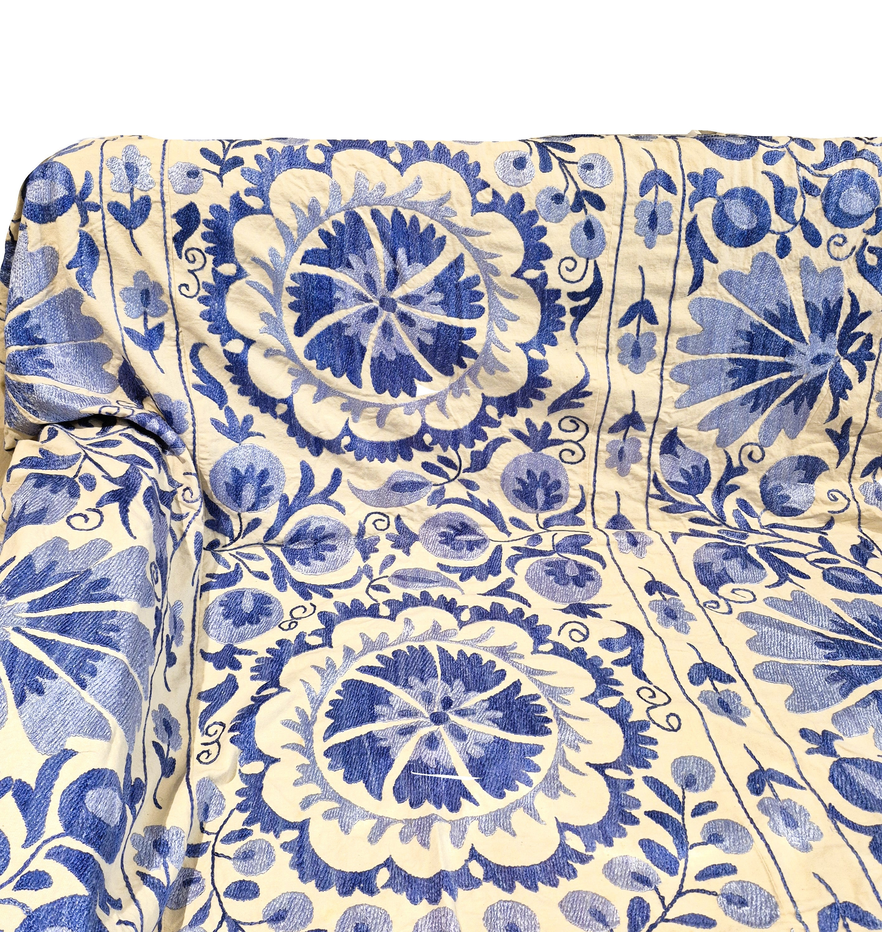 Royal blue embroidered suzani fabric with flowers and mandalas