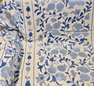 Suzani with blue pomegranate and leaf pattern on cream background