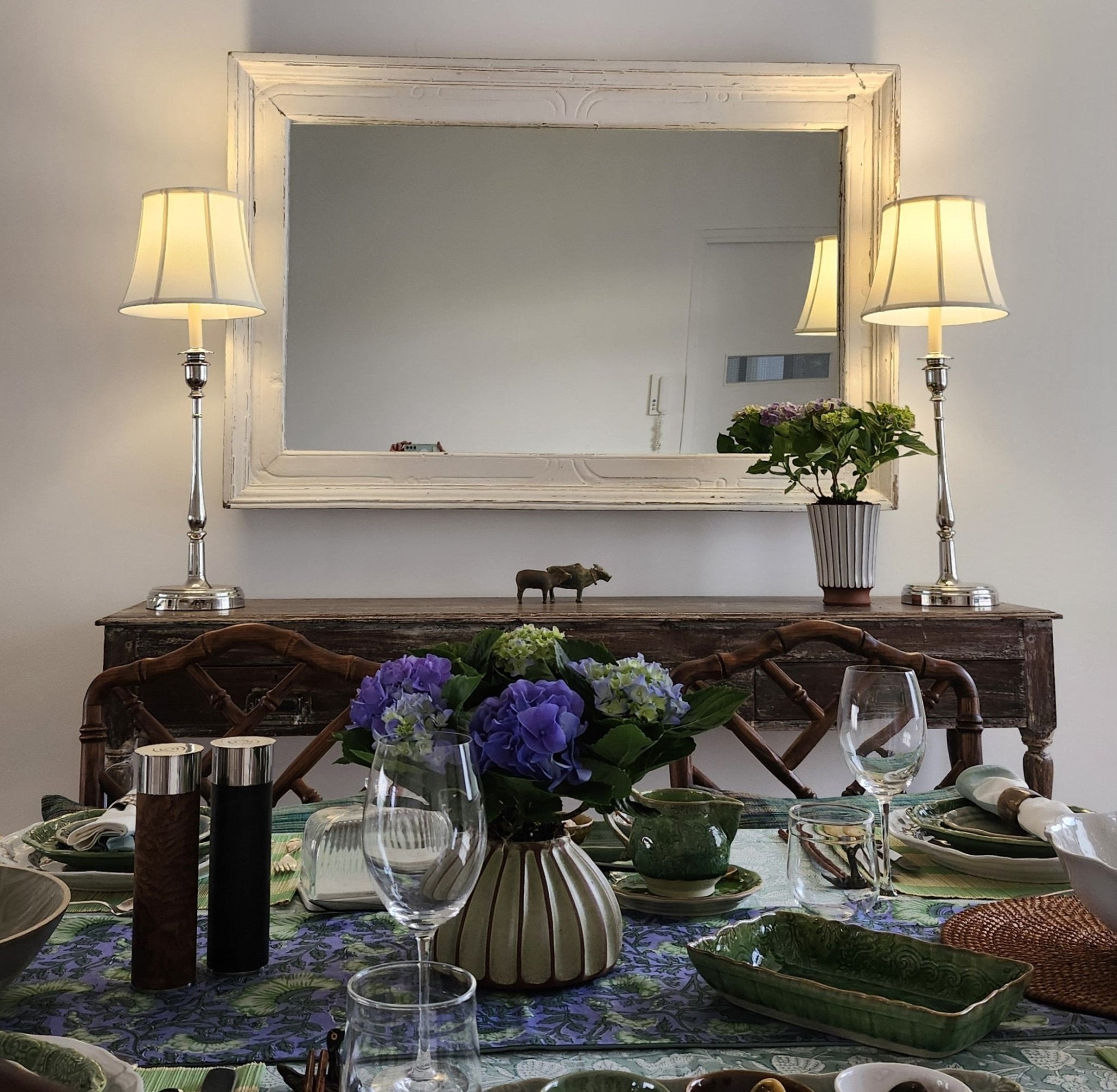 Chrome table lamp styled on a vintage console