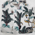 Cotton waffle dressing gown with an all over safari block print, a belt and two large pockets, 128cm.