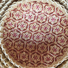 Round woven wicker basket with pink mosaic interior, handcrafted storage basket