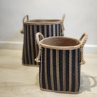 Wicker laundry basket with a dark blue stripe and rope handles