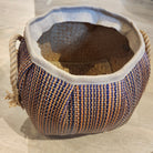 Medium wicker basket with a dark stripe and rope handles, 30cm high and 27cm in diameter, handy for laundry storage