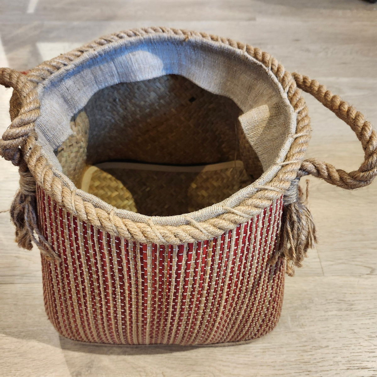 Pink wicker basket with a dark stripe and rope handles, 28cm high and 27cm in diameter, handcrafted and lightweight