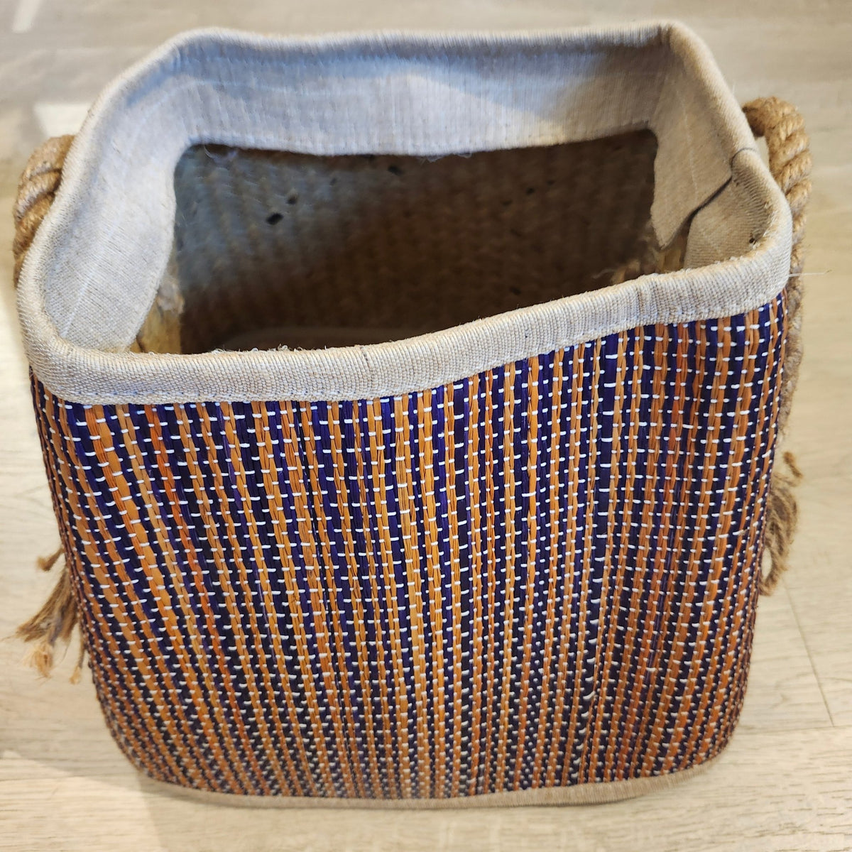 Small wicker basket with a dark stripe and rope handles, 28cm high and 22cm wide, handcrafted from lightweight wicker