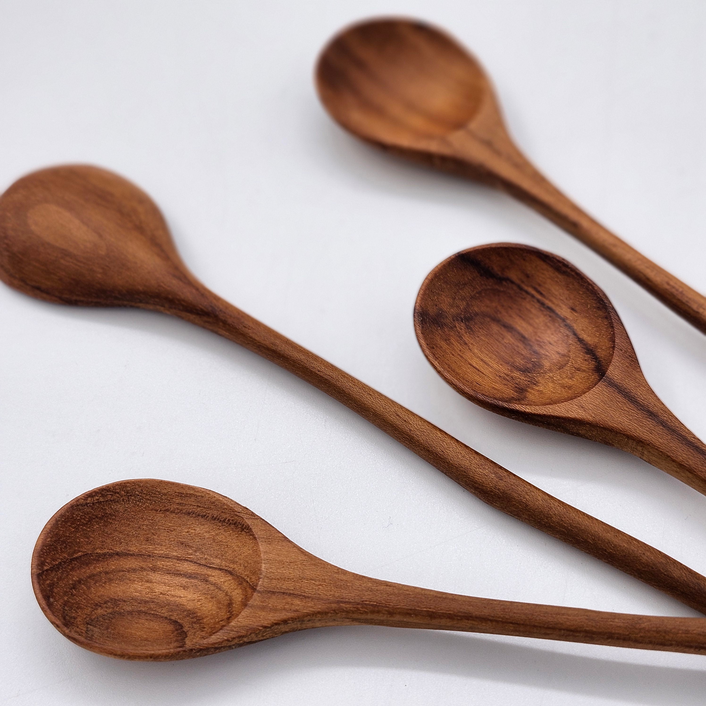 Teak wooden jam spoon with curved handle, detail