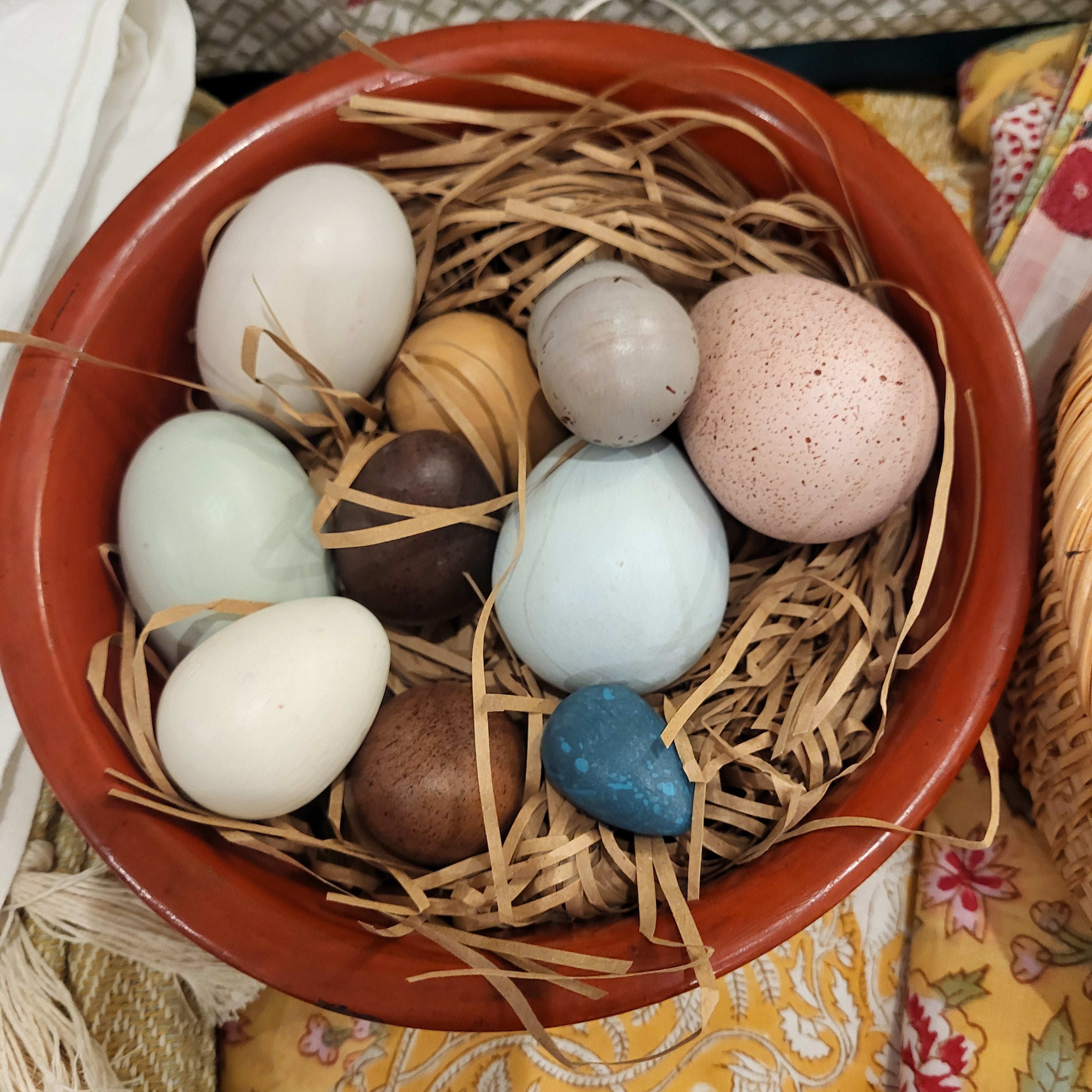 Wooden eggs in vintage red lacquer bowl